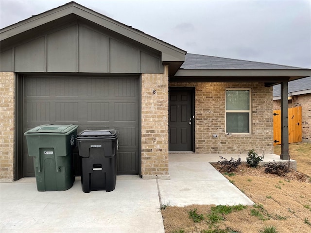 2313 Zanoletti Ct, Temple, TX 76504 - ranch-style home with brick siding, a garage, board and batten siding, and a shingled roof