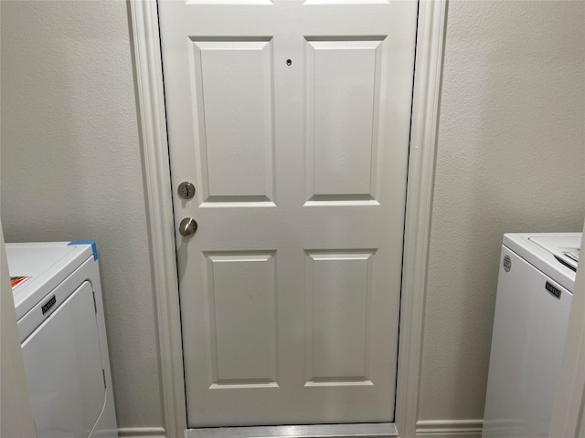 2313 Zanoletti Ct, Temple, TX 76504 - washroom featuring washing machine and dryer and a textured wall