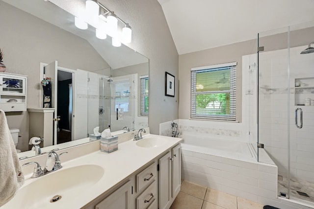 10603 Watchful Fox Dr, Austin, TX 78748 - full bath with lofted ceiling, tile patterned floors, a garden tub, a shower stall, and toilet