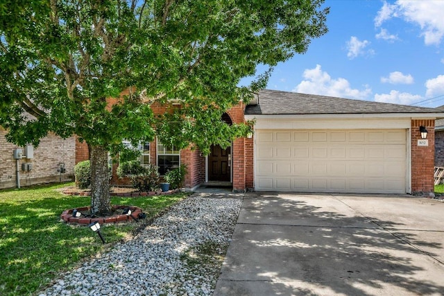 102 Cavalry Trl, Elgin, TX 78621 - view of front of home featuring brick siding, driveway, an attached garage, and a front yard
