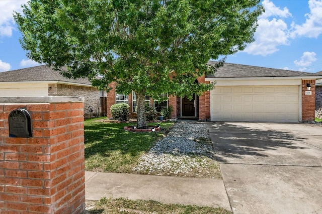 102 Cavalry Trl, Elgin, TX 78621 - obstructed view of property featuring brick siding, driveway, a garage, a front lawn, and roof with shingles