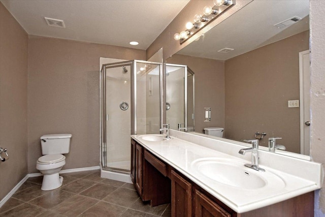102 Cavalry Trl, Elgin, TX 78621 - bathroom featuring toilet, double vanity, a stall shower, tile patterned floors, and baseboards