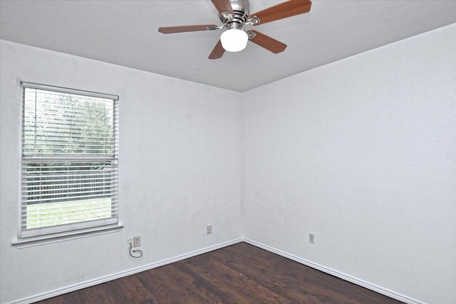 102 Cavalry Trl, Elgin, TX 78621 - empty room with dark wood-style flooring, healthy amount of natural light, and ceiling fan