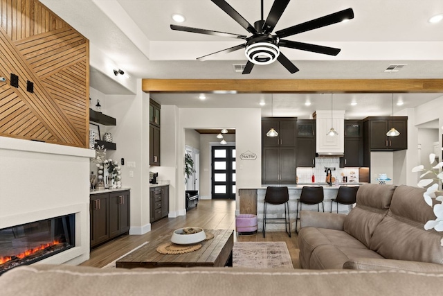 4374 Tall Rdg, Kempner, TX 76539 - living room with ceiling fan, light wood-style floors, baseboards, a glass covered fireplace, and recessed lighting
