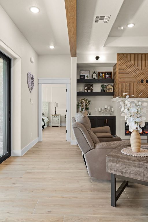 4374 Tall Rdg, Kempner, TX 76539 - living area featuring light wood-style floors, recessed lighting, and baseboards