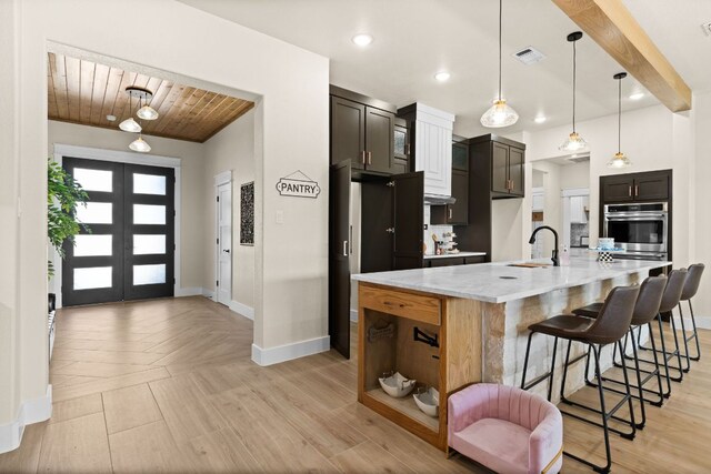 4374 Tall Rdg, Kempner, TX 76539 - kitchen featuring stainless steel oven, wooden ceiling, a spacious island, a breakfast bar, and pendant lighting