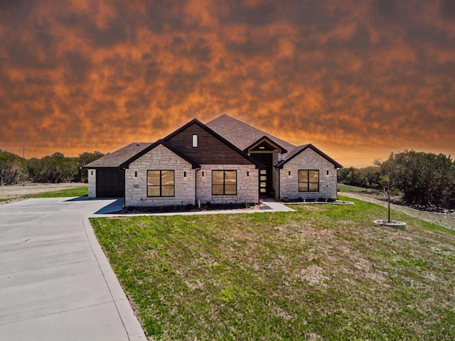 4374 Tall Rdg, Kempner, TX 76539 - view of front of home featuring stone siding, concrete driveway, an attached garage, and a front yard