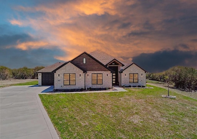 4374 Tall Rdg, Kempner, TX 76539 - modern inspired farmhouse with stone siding, driveway, a yard, and an attached garage