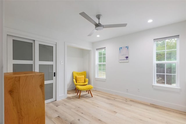2419 Trail Of The Madrones, Austin, TX 78746 - sitting room with light wood finished floors, ceiling fan, and recessed lighting