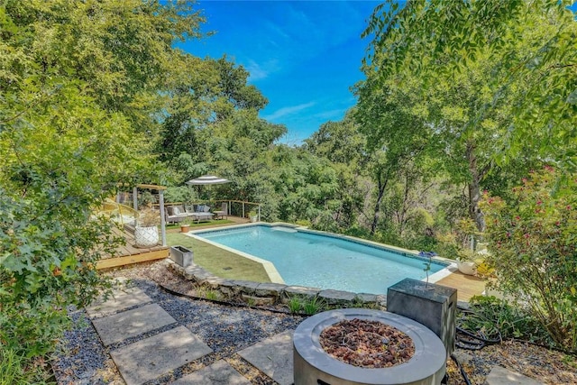 2419 Trail Of The Madrones, Austin, TX 78746 - swimming pool with a fire pit and a wooden deck