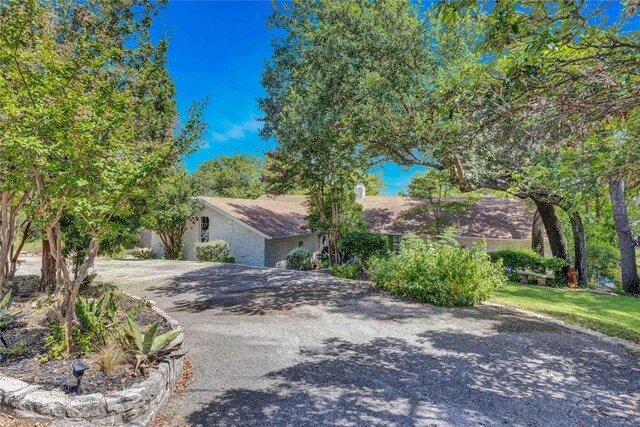 2419 Trail Of The Madrones, Austin, TX 78746 - view of property hidden behind natural elements