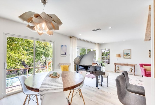 2419 Trail Of The Madrones, Austin, TX 78746 - dining room featuring light wood-style floors and recessed lighting