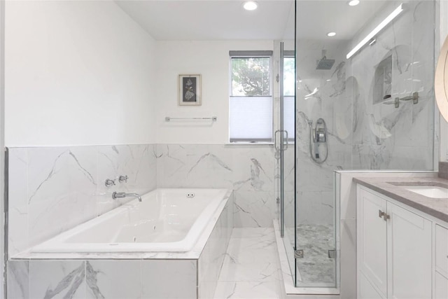 2419 Trail Of The Madrones, Austin, TX 78746 - bathroom with a marble finish shower, a tub with jets, marble finish flooring, vanity, and tile walls