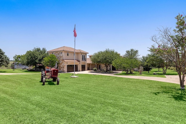 17308 Saint Therese Rd, Manor, TX 78653 - view of community with concrete driveway, a garage, and a lawn