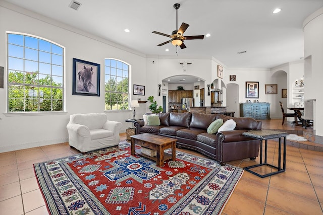 17308 Saint Therese Rd, Manor, TX 78653 - living area featuring arched walkways, ceiling fan, light tile patterned floors, recessed lighting, and baseboards