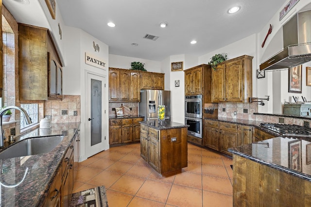 17308 Saint Therese Rd, Manor, TX 78653 - kitchen featuring appliances with stainless steel finishes, a sink, backsplash, extractor fan, and recessed lighting