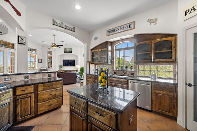 17308 Saint Therese Rd, Manor, TX 78653 - kitchen featuring stainless steel dishwasher, a sink, ceiling fan, light tile patterned flooring, and recessed lighting