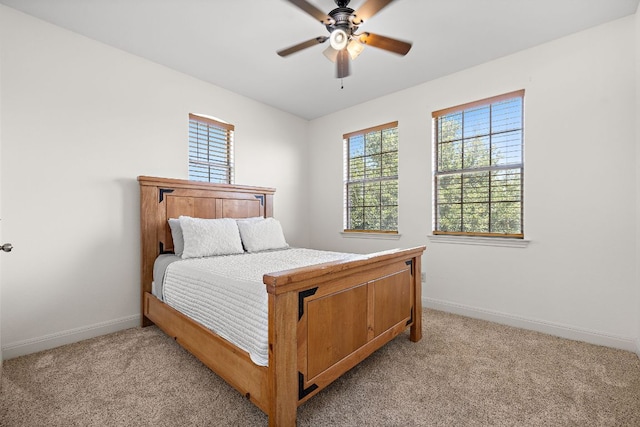 17308 Saint Therese Rd, Manor, TX 78653 - bedroom with light colored carpet, baseboards, and ceiling fan