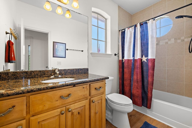 17308 Saint Therese Rd, Manor, TX 78653 - bathroom featuring vanity, toilet, shower / bath combo, and wood finished floors