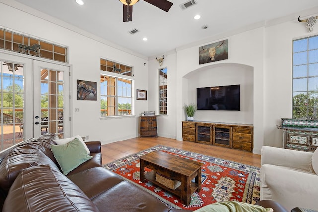17308 Saint Therese Rd, Manor, TX 78653 - living room with tile patterned floors, ceiling fan, recessed lighting, french doors, and baseboards