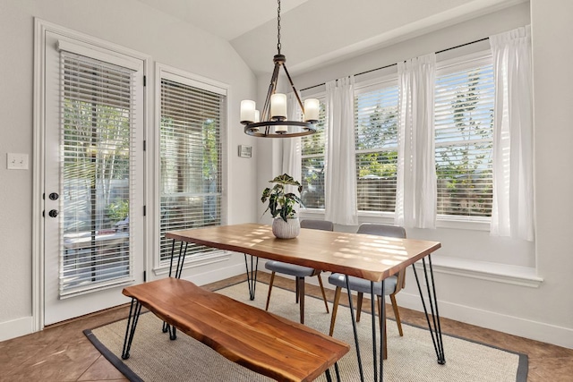 114 Fred Couples Dr, Round Rock, TX 78664 - dining area featuring baseboards, a chandelier, and vaulted ceiling
