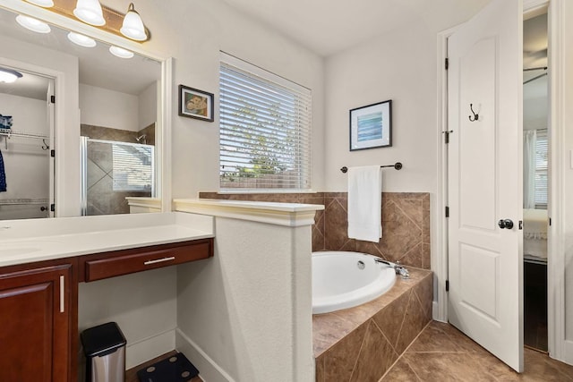114 Fred Couples Dr, Round Rock, TX 78664 - bathroom with vanity, a bath, a stall shower, and tile patterned floors