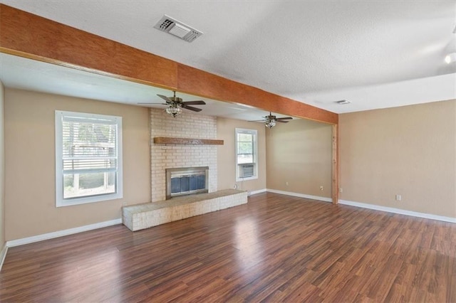 461 Skyline Rdg, San Marcos, TX 78666 - unfurnished living room with healthy amount of natural light, wood finished floors, and baseboards