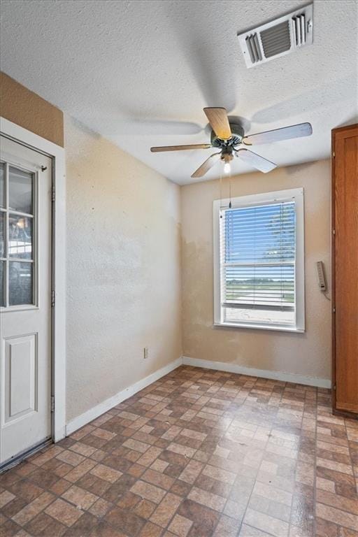461 Skyline Rdg, San Marcos, TX 78666 - empty room featuring brick patterned flooring, baseboards, and a ceiling fan