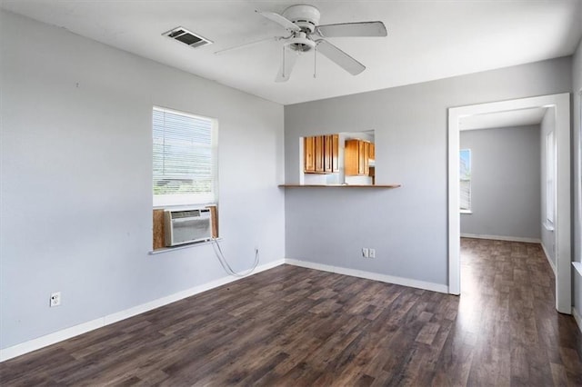 461 Skyline Rdg, San Marcos, TX 78666 - empty room featuring dark wood-style flooring, a ceiling fan, baseboards, and cooling unit