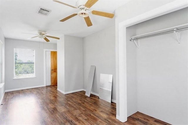 461 Skyline Rdg, San Marcos, TX 78666 - unfurnished bedroom featuring wood finished floors, a closet, ceiling fan, and baseboards
