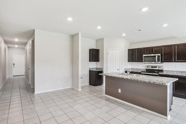 9701 Kensley Rose Dr, Killeen, TX 76542 - kitchen with appliances with stainless steel finishes, a sink, light stone counters, recessed lighting, and tasteful backsplash