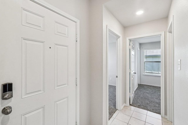 9701 Kensley Rose Dr, Killeen, TX 76542 - hallway featuring light colored carpet, light tile patterned floors, and baseboards