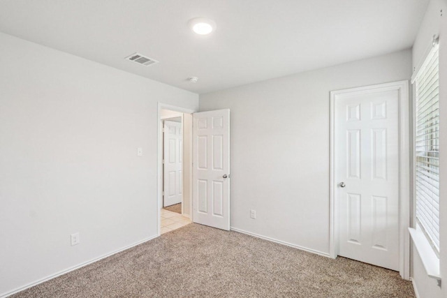 9701 Kensley Rose Dr, Killeen, TX 76542 - unfurnished bedroom featuring light carpet and baseboards