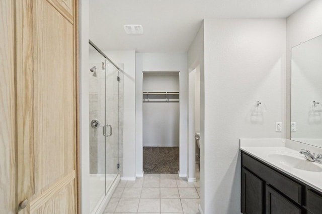 9701 Kensley Rose Dr, Killeen, TX 76542 - full bath featuring vanity, a stall shower, tile patterned floors, and a walk in closet