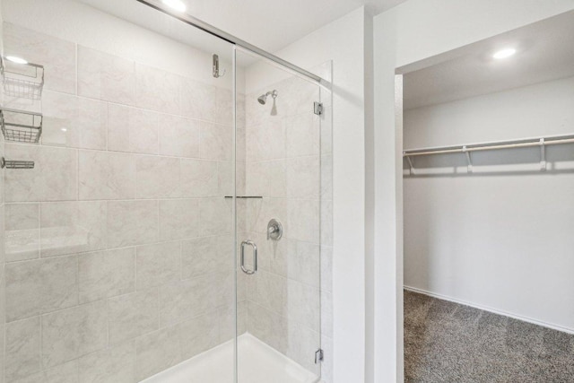 9701 Kensley Rose Dr, Killeen, TX 76542 - bathroom with a stall shower, a spacious closet, and recessed lighting
