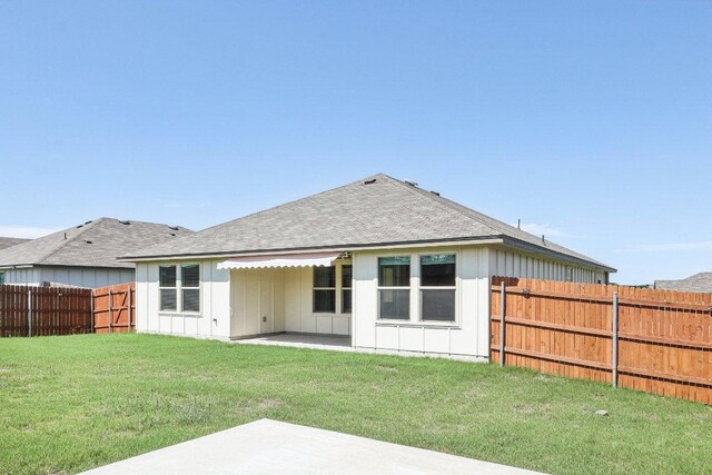 9701 Kensley Rose Dr, Killeen, TX 76542 - back of property featuring board and batten siding, a patio area, and roof with shingles