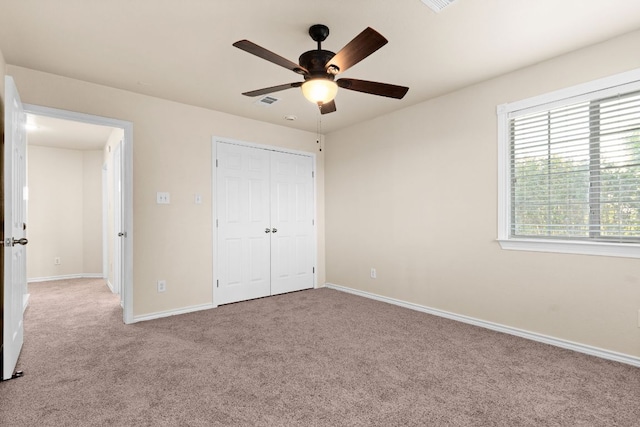 10 Saul St, Lampasas, TX 76550 - unfurnished bedroom with carpet flooring, baseboards, a closet, and a ceiling fan