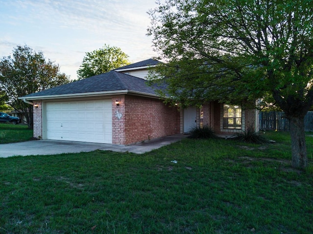 10 Saul St, Lampasas, TX 76550 - view of front facade with a garage, concrete driveway, brick siding, and roof with shingles
