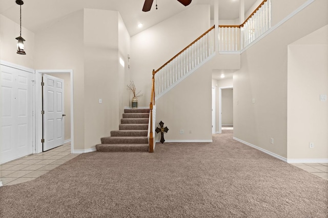 10 Saul St, Lampasas, TX 76550 - entryway featuring high vaulted ceiling, light colored carpet, ceiling fan, stairs, and light tile patterned flooring
