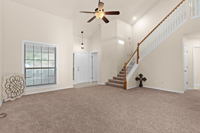 10 Saul St, Lampasas, TX 76550 - carpeted entrance foyer with high vaulted ceiling, stairs, a ceiling fan, and baseboards