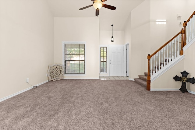 10 Saul St, Lampasas, TX 76550 - foyer with carpet floors, high vaulted ceiling, stairs, a ceiling fan, and baseboards