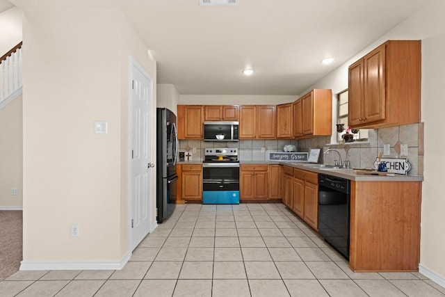 10 Saul St, Lampasas, TX 76550 - kitchen featuring black appliances, tasteful backsplash, light tile patterned flooring, a sink, and light countertops