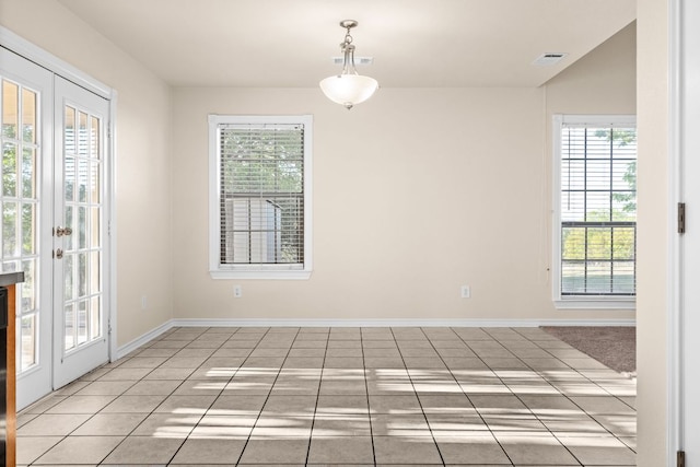 10 Saul St, Lampasas, TX 76550 - spare room featuring plenty of natural light, baseboards, and light tile patterned floors