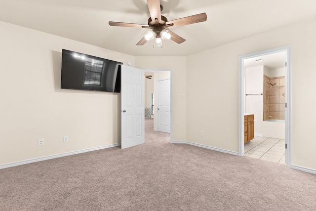 10 Saul St, Lampasas, TX 76550 - unfurnished bedroom featuring light carpet, baseboards, ensuite bath, and ceiling fan