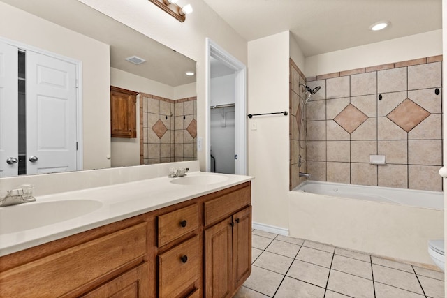 10 Saul St, Lampasas, TX 76550 - bathroom with toilet, double vanity, tile patterned floors, bathing tub / shower combination, and recessed lighting