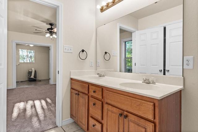 10 Saul St, Lampasas, TX 76550 - full bath featuring double vanity, a ceiling fan, plenty of natural light, and tile patterned floors