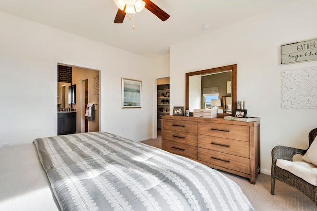 8169 Daisy Cutter Xing, Georgetown, TX 78626 - bedroom with light colored carpet, ensuite bathroom, baseboards, and a ceiling fan