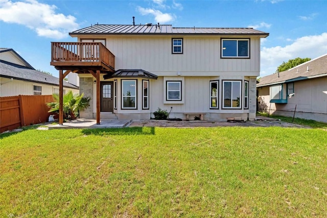 1145 Lago Vista St, San Marcos, TX 78666 - rear view of house with a metal roof, a standing seam roof, and a deck