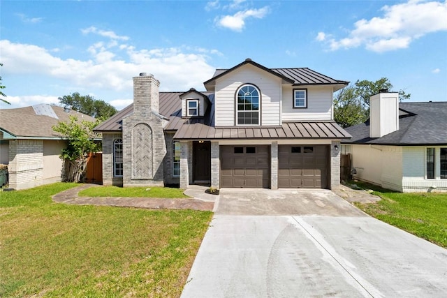 1145 Lago Vista St, San Marcos, TX 78666 - view of front facade with a standing seam roof, driveway, metal roof, an attached garage, and a front lawn