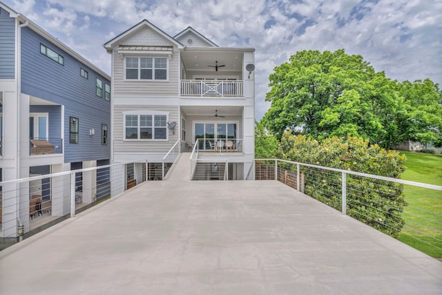 127 Cypress Shores Ln, Kingsland, TX 78639 - back of property with a ceiling fan, a balcony, and stairs